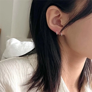 Minimalist S925 sterling silver hoop earrings shown on a model for everyday style