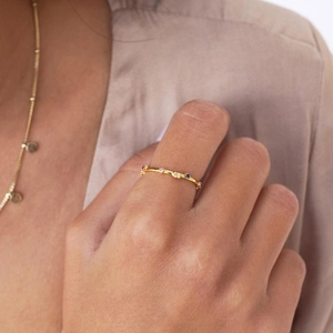 Minimalist 18k gold thin ring with colorful zircon stones on female model hand