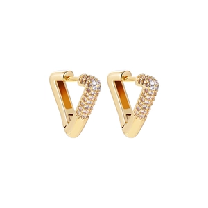 Detail of 18K gold triangular heart earrings featuring sparkling micro-pave cubic zirconia