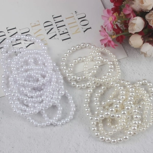 Round pearl bracelets in white and cream tones for kids DIY handmade jewelry gifts