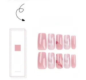 Detail of pink marble press-on nails with gold foil and gradient long coffin design