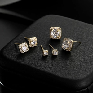 Three-piece set of square gold plated stud earrings with pavé cubic zirconia inlay