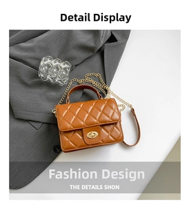 Detail view of brown quilted crossbody bag with gold chain strap and metal turn-lock