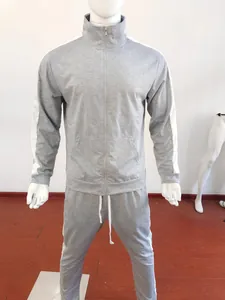 Detail view of heather grey tracksuit set featuring side stripes and ribbed cuffs on a mannequin