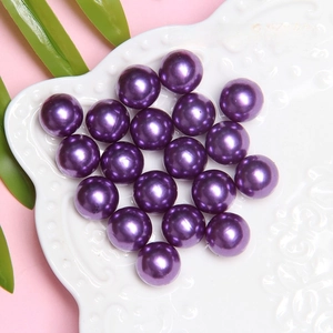 Macro detail of 12mm lavender purple ABS faux pearls for DIY crafts and hair accessories
