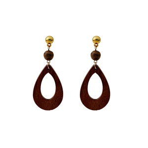 Macro detail of teardrop wooden earrings with gold metallic finish on white background