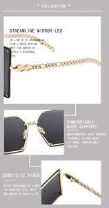 Detailed view of golden chain temples and reinforced hinges on oversized sunglasses