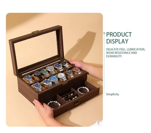 Detailed view of dual-layer vintage wood grain watch box with glass lid and drawer