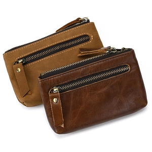 Front view of two genuine leather coin purses with three zippers in brown and tan