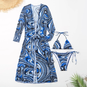 Three-piece bikini set with blue marble print cover-up and halter top for summer beachwear