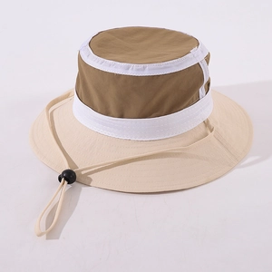 Detail of color-block kids bucket hat with khaki crown and beige brim plus windproof rope