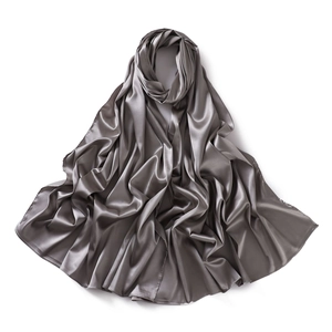 Close-up of elegant grey satin scarf showing smooth texture and soft silk-like folds