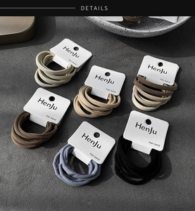 Detail of multi-color elastic hair bands set in earth tones on display cards