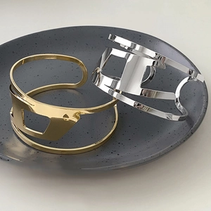 Irregular double-layer open bangle set with geometric hollow design in gold and silver