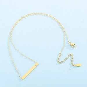 Detailed view of gold bar pendant necklace with small diamond and lobster clasp detail