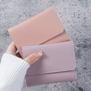 Minimalist short tri-fold faux leather wallets for women in pink and purple colors