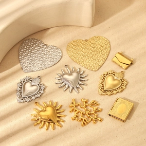 Gold and silver stainless steel heart and envelope charms with embossed sun patterns