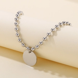 Bracelet à chaîne de perles argentées avec pendentif rond poli pour gravure