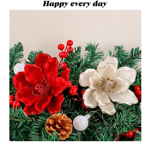 Close-up of red velvet Christmas flower with pine cones, berries and green needles