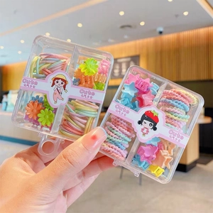 Close-up of candy-colored kids hair accessories set in a four-compartment storage box