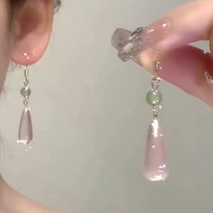 Pink resin waterdrop earrings with green beads in a minimalist Neo-Chinese style