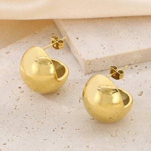 Minimalist golden dome stud earrings made of stainless steel on stone tray and silk