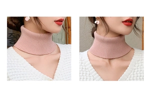Pink knitted cashmere neck warmer shown on model with high collar texture detail