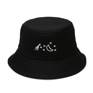 Black cotton bucket hat with moon and star embroidery on white background