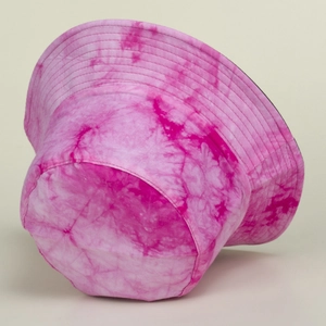 Detailed view of pink tie-dye bucket hat with cotton twill texture and reinforced stitching
