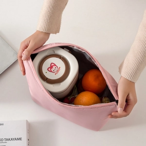 Pink insulated lunch bag with aluminum foil lining shown in a top-down open view