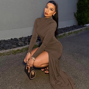 Detailed close-up of brown bodycon dress showing ruched texture and side slit
