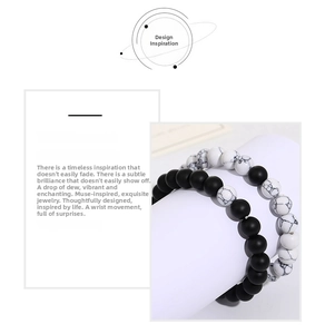 Close-up of matte black agate and white turquoise beaded bracelets for couples
