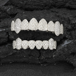 Silver plated hip hop grillz set with sparkling cubic zirconia on charcoal background
