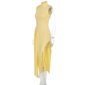Detail of light yellow high-neck dress showing elegant side ruching and a bold side slit