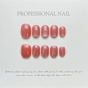 Cat eye glitter press-on nails in coral pink with 10 pieces short round square shape