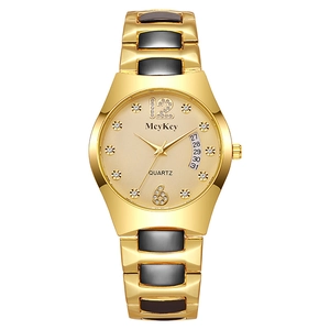 Detail view of McyKey gold watch with crystal markers and date display window