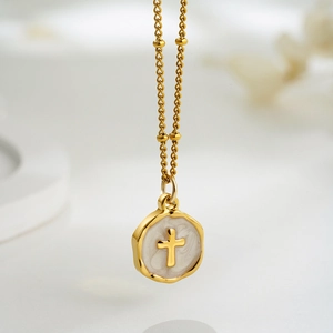 18K gold plated stainless steel necklace featuring a cross embossed white enamel pendant