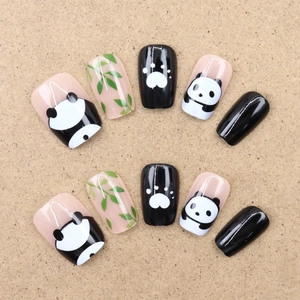 Cute panda and green bamboo themed press-on nails set with glossy black and white finish
