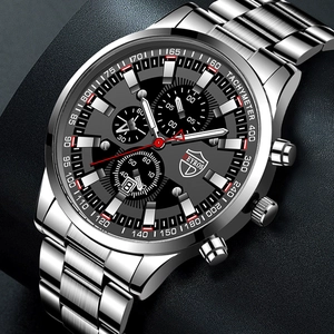 Macro detail of men's chronograph watch with black dial and tachymeter on steel band