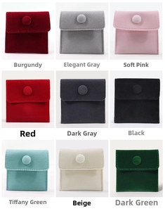 Velvet jewelry pouches in nine colors showing soft texture and snap button closure