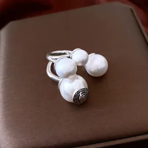 Vintage silver ring with Medusa relief, Greek fret patterns and white pearls