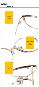 Detail display of golden metal eyeglass frames showing nose pads and curved legs