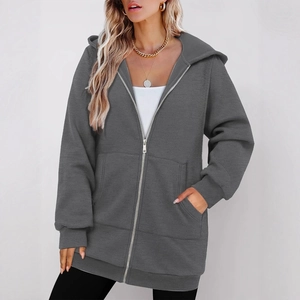 Dark grey longline hoodie with zip closure and side pockets on female model