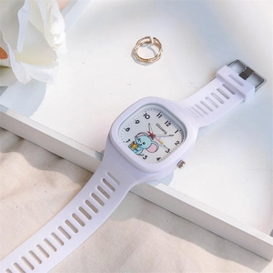 Close-up of white silicone watch with cute elephant dial on a decorative white tray