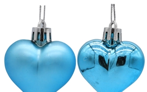 Detail of matte and glossy blue heart ornaments with silver caps and wire hangers