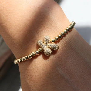 18k gold plated butterfly bracelet featuring micro-pave zircon crystals on wrist