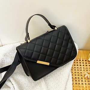 Chic black quilted crossbody bag with gold trim and wide fabric strap for women