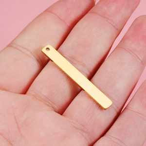 Polished gold rectangular stainless steel bar pendant for DIY jewelry making on palm