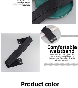 Detail of black elastic waist belt for women with leather texture and silver buckle
