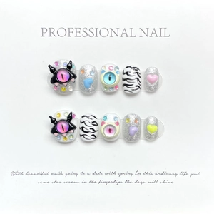 Handmade 3D cartoon monster press-on nails with zebra patterns and colorful rhinestones